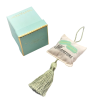 Coussin Macaron à parfumer avec pompon vert – Atelier Catherine Masson