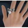 Bague fantaisie nœud papillon ajouré et perle